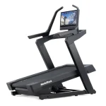 A person running on the NordicTrack X24 Treadmill, showing its large 24-inch touchscreen display
