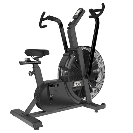 A person performing a high-intensity workout on the Bike HD Air Hammer Strength, showing both arm and leg movement