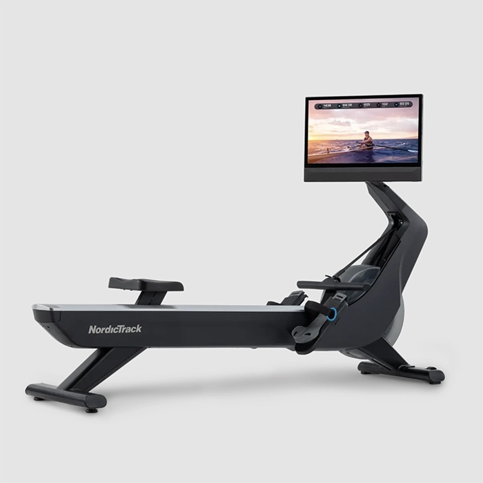 A person rowing on the Rower NEW RW900 NordicTrack, showing its large 24-inch touchscreen display A person rowing on the Rower NEW RW900 NordicTrack, showing its large 24-inch touchscreen display