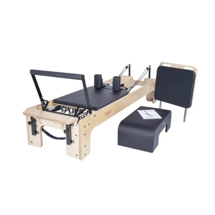 Fitkon Pilates Powerhouse Reformer with premium wood frame and black upholstered carriage