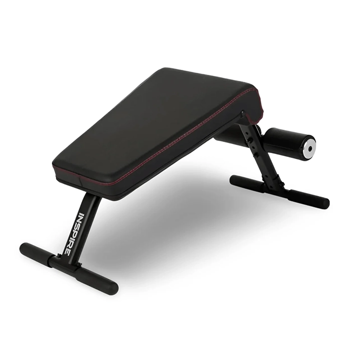 Front view of the Inspire Fitness Mini Crunch Bench set on a clean floor Front view of the Inspire Fitness Mini Crunch Bench set on a clean floor