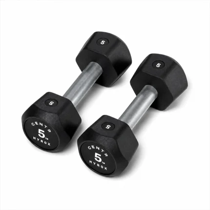 Pair of Centr x HYROX 5kg Commercial Dumbbell urethane dumbbells on a gym floor