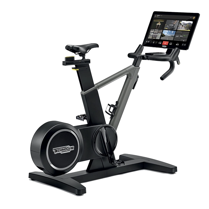 Technogym Ride Smart Bike with immersive 22-inch touchscreen displaying a virtual route Technogym Ride Smart Bike with immersive 22-inch touchscreen displaying a virtual route