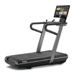 Technogym Run HIIT Treadmill with 27-inch HD display in a luxury home gym cardio