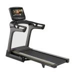 The Matrix TF50 Folding Treadmill 22 inch XUR with its large 22-inch XUR touchscreen console, shown in its upright, folded position