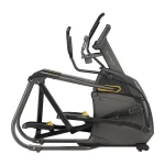 User exercising on the Elliptical A50 Matrix 10 inch XER, demonstrating incline with HR strap